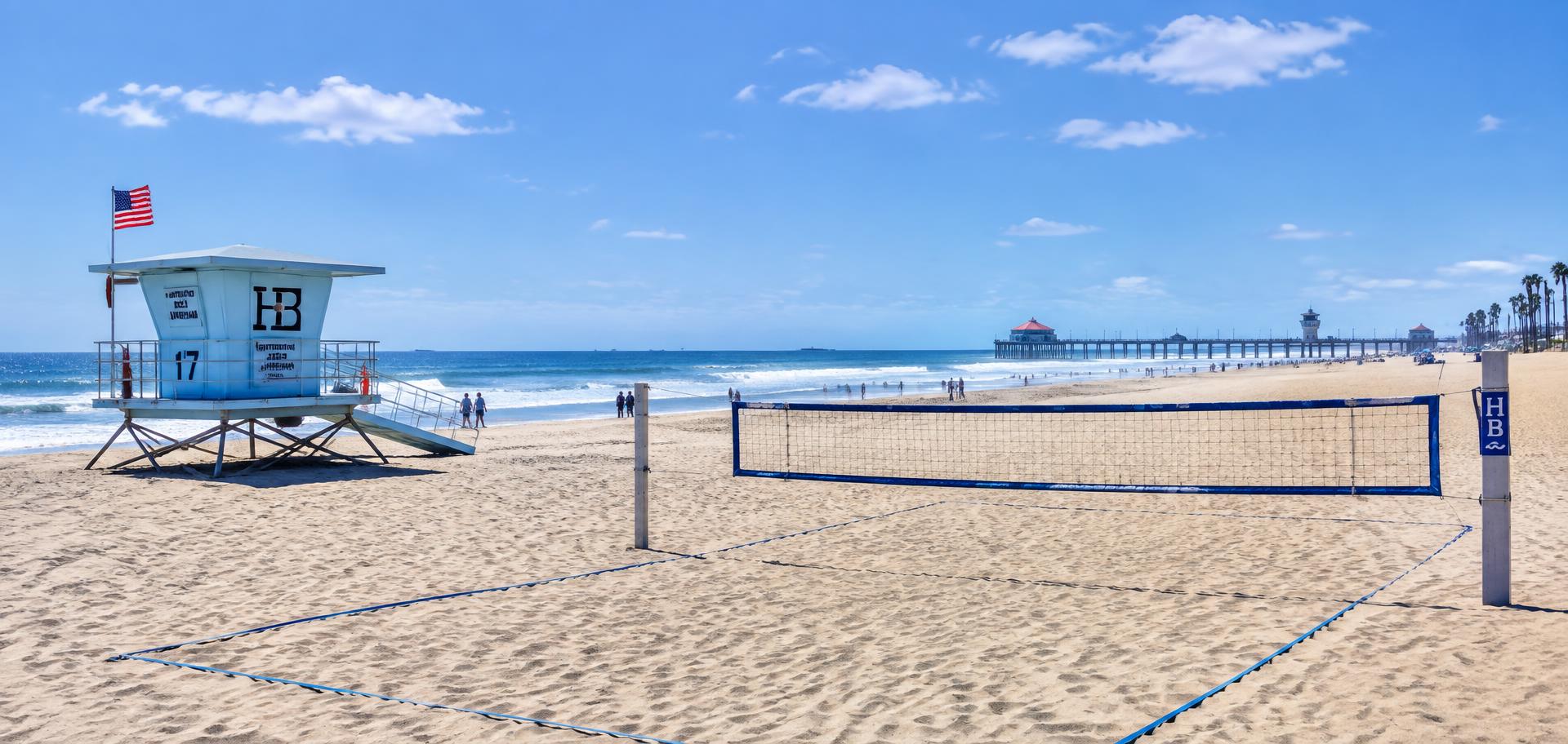 Huntington Beach with a lifeguard tower and a volleyball court